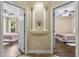 Hallway view with decorative alcove and entrances to two bedrooms with ceiling fans at 1813 Glenbay Ct, Windermere, FL 34786
