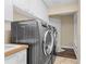 The laundry room features a sink and stainless steel washer and dryer at 1813 Glenbay Ct, Windermere, FL 34786