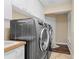 Laundry room area with large washer and dryer sets at 1813 Glenbay Ct, Windermere, FL 34786