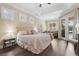 Relaxing main bedroom features plantation shutters, tray ceiling, and french doors at 1813 Glenbay Ct, Windermere, FL 34786