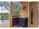 Covered outdoor kitchen, featuring stainless steel appliances and ample countertop space at 1813 Glenbay Ct, Windermere, FL 34786