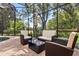 Outdoor patio with stone pavers and furniture with a screen surrounding the outdoor living space at 1813 Glenbay Ct, Windermere, FL 34786