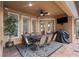 Outdoor patio with ceiling fan and dining table with an outdoor grill at 1813 Glenbay Ct, Windermere, FL 34786