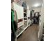Walk-in closet with custom shelving and ample storage for clothes, shoes, and accessories at 1813 Glenbay Ct, Windermere, FL 34786