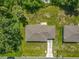 Overhead view of homes showcasing roofing, green lawns, and neighborhood setting at 1816 Alexander Ave, Sanford, FL 32771