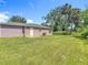 Spacious backyard with lush lawn and access to the home, perfect for entertaining at 1816 Alexander Ave, Sanford, FL 32771