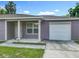 Close up of exterior, featuring a one car garage, front door, and well maintained lawn at 1816 Alexander Ave, Sanford, FL 32771