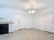 Bright dining area featuring modern light fixture, new paint, and hardwood floors at 1816 Alexander Ave, Sanford, FL 32771
