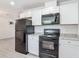 Kitchen with modern appliances and white cabinets at 1816 Alexander Ave, Sanford, FL 32771
