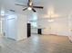 Open-concept living space featuring wood look flooring and white walls, connecting to the kitchen at 1816 Alexander Ave, Sanford, FL 32771