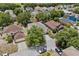 Aerial view of the property showcasing the home, landscaping, and surrounding neighborhood at 1905 Emily Blvd, Winter Haven, FL 33884