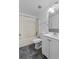 Clean bathroom features a shower/tub combo, white tiled walls, and a white vanity at 1905 Emily Blvd, Winter Haven, FL 33884