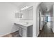Bathroom with a large mirror and a gray vanity at 1905 Emily Blvd, Winter Haven, FL 33884