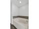 Soaking tub with decorative tile at 1905 Emily Blvd, Winter Haven, FL 33884