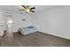 This bedroom features wood-look floors, a ceiling fan, and closet at 1905 Emily Blvd, Winter Haven, FL 33884