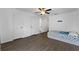 This bedroom features wood-look floors, a ceiling fan, and closet at 1905 Emily Blvd, Winter Haven, FL 33884