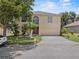 Charming two-story home features lush landscaping and a large two-car garage at 1905 Emily Blvd, Winter Haven, FL 33884