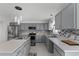 Bright kitchen featuring stainless steel appliances, tile backsplash, and ample countertop space at 1905 Emily Blvd, Winter Haven, FL 33884