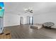 Open living room has wood-look floors, white walls, and natural light at 1905 Emily Blvd, Winter Haven, FL 33884