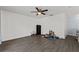 Unfurnished living room with vinyl flooring and modern ceiling fan at 1905 Emily Blvd, Winter Haven, FL 33884