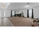 Spacious living room with neutral carpet, modern curtains, and ample natural light at 1905 Emily Blvd, Winter Haven, FL 33884