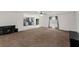 Spacious living room with tile floor and carpet flooring, plenty of natural light, and modern ceiling fan at 1905 Emily Blvd, Winter Haven, FL 33884