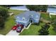 Charming two-story home with a two-car garage, well-manicured lawn, and tasteful landscaping at 2032 Wavyleaf Ct, Apopka, FL 32712