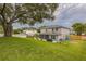 Spacious backyard with an expansive lawn, perfect for outdoor activities and enjoying nature at 2032 Wavyleaf Ct, Apopka, FL 32712