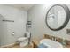 Bathroom featuring wood look tile floors, toilet, sink with new fixture, and mirror at 2032 Wavyleaf Ct, Apopka, FL 32712
