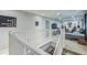 Upstairs bonus room with white railing and a view to an entertainment area at 2032 Wavyleaf Ct, Apopka, FL 32712
