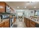 Well-equipped kitchen featuring sleek countertops, stainless steel appliances, and stylish cabinetry at 2032 Wavyleaf Ct, Apopka, FL 32712