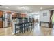 Kitchen with barstool seating at the counter and modern stainless steel refrigerator at 2032 Wavyleaf Ct, Apopka, FL 32712