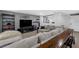 Inviting living room with a sectional sofa, entertainment center, and comfortable decor at 2032 Wavyleaf Ct, Apopka, FL 32712