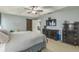 View of main bedroom featuring a decorative sliding barn door and a large television mounted on the wall at 2032 Wavyleaf Ct, Apopka, FL 32712