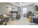 Home office setup with multiple desks, computer setups, and comfortable office chairs at 2032 Wavyleaf Ct, Apopka, FL 32712