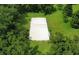 Aerial view of the community sand volleyball court surrounded by lush greenery at 2032 Wavyleaf Ct, Apopka, FL 32712