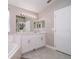 Bright bathroom featuring a tub and shower combo with a marble countertop sink at 207 Langham Dr, Davenport, FL 33897