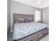 Comfortable bedroom featuring a cozy bed with stylish patterned bedding and soft pillows at 207 Langham Dr, Davenport, FL 33897