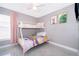 Cozy bedroom with bunkbeds featuring colorful bedding and charming decor at 207 Langham Dr, Davenport, FL 33897