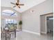 Open dining space with bright window and tile floors adjacent to bathroom at 207 Langham Dr, Davenport, FL 33897