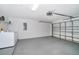 Spacious garage with a laundry area and ample room for parking and storage at 207 Langham Dr, Davenport, FL 33897