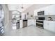 Bright, spacious kitchen with granite countertops, stainless steel appliances, and a dining area at 207 Langham Dr, Davenport, FL 33897