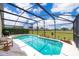 Beautiful, screened-in pool and patio area is ideal for outdoor enjoyment and entertaining at 207 Langham Dr, Davenport, FL 33897