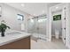 Bright bathroom featuring a glass enclosed shower, modern vanity with white countertop, and sleek fixtures at 2300 S Brown Ave, Orlando, FL 32806