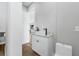 Modern powder room with a vessel sink, black faucet, and sleek white cabinets at 2300 S Brown Ave, Orlando, FL 32806