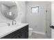 Modern bathroom featuring a sleek vanity, a frameless glass shower, and contemporary fixtures at 2300 S Brown Ave, Orlando, FL 32806