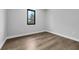 Bedroom featuring modern flooring and a window for natural light at 2300 S Brown Ave, Orlando, FL 32806