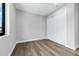 Minimal bedroom with hard wood floors, window, and a closet at 2300 S Brown Ave, Orlando, FL 32806
