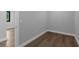 View of a simple, empty bedroom featuring light hardwood floors and light gray walls at 2300 S Brown Ave, Orlando, FL 32806