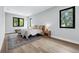 Bright bedroom featuring hardwood floors, natural light, and neutral tones at 2300 S Brown Ave, Orlando, FL 32806
